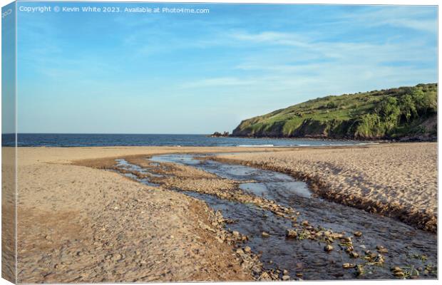 Stream leading down to Freshwater East beach in evening Canvas Print by Kevin White