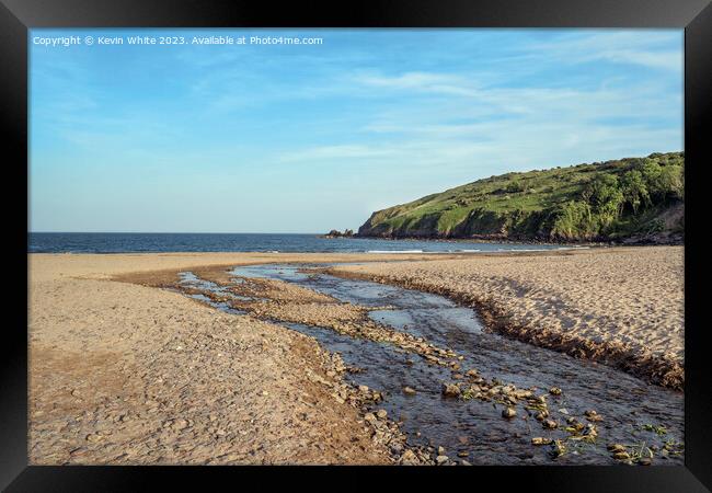 Stream leading down to Freshwater East beach in evening Framed Print by Kevin White