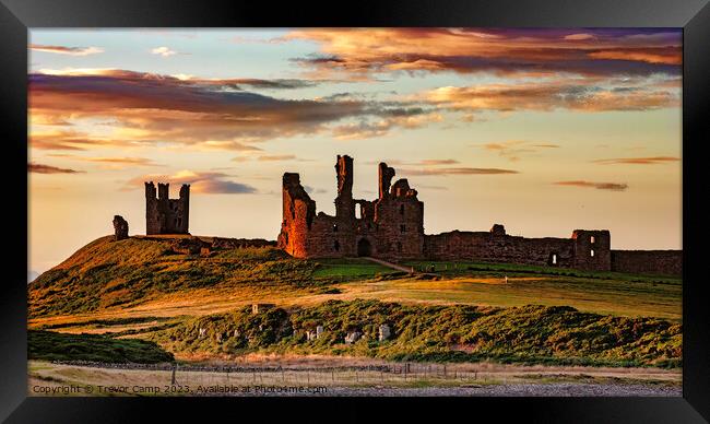 A Timeless Fortress: Dunstanburgh Castle Framed Print by Trevor Camp