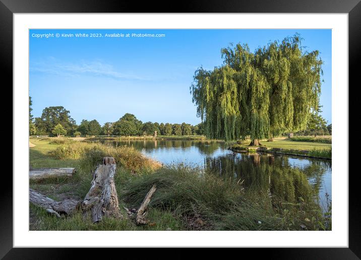 Perfect resting place just sitting on a log next to water Framed Mounted Print by Kevin White