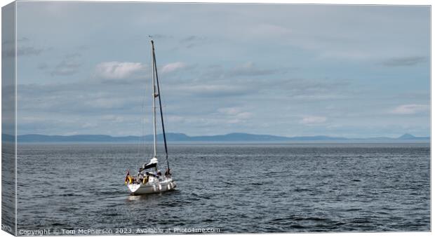 Solitary Sail: A Serene Encounter Canvas Print by Tom McPherson