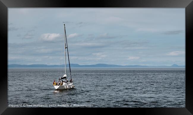 Solitary Sail: A Serene Encounter Framed Print by Tom McPherson