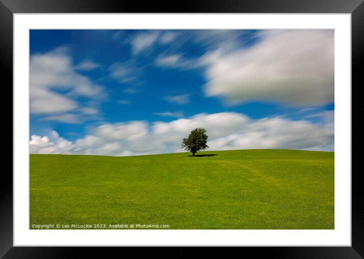 Lone Tree and an Outdoor field Framed Mounted Print by Les McLuckie