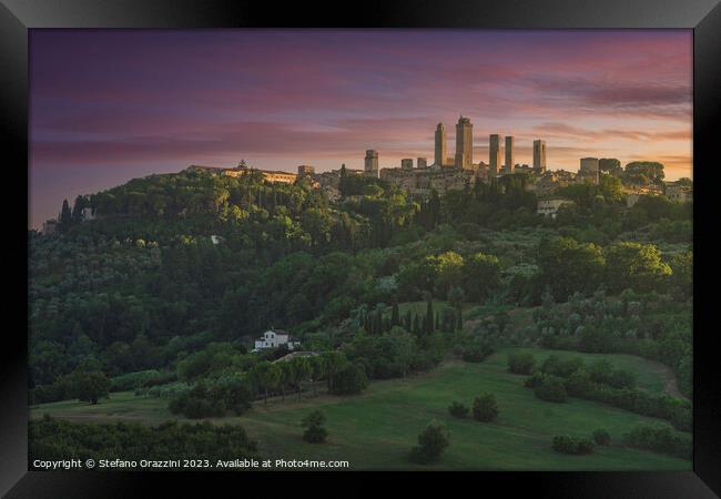 The towers of the village of San Gimignano at sunset. Italy Framed Print by Stefano Orazzini