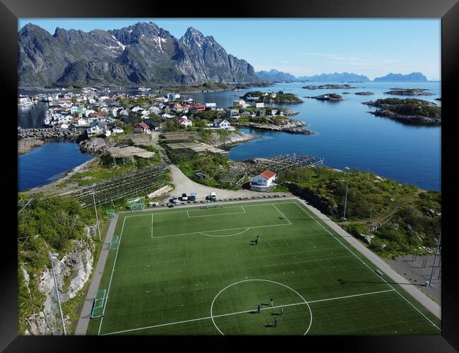Aerial view of fishing village and football field on Lofoten Islands in Norway Framed Print by Irena Chlubna
