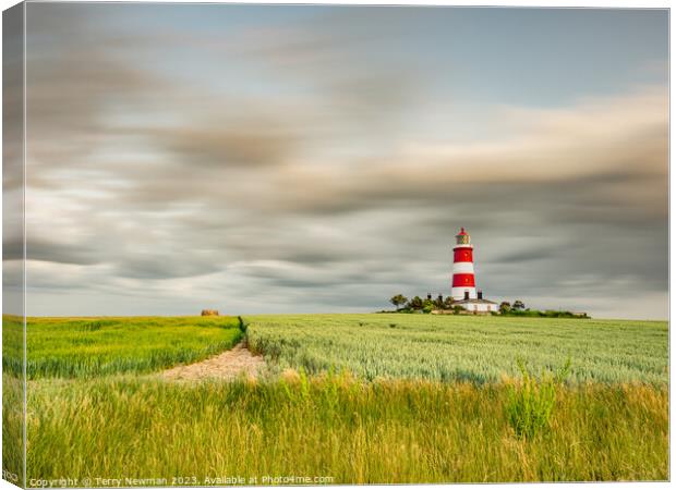 Happisburgh Lighthouse with a dramatic sky Canvas Print by Terry Newman