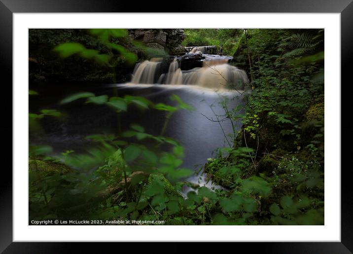 waterfall through the bushes Framed Mounted Print by Les McLuckie
