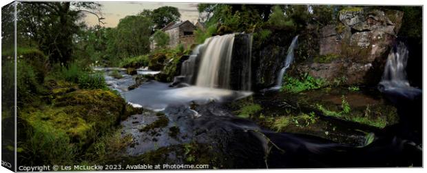 Waterfall at an old mill  Canvas Print by Les McLuckie