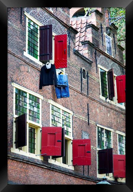 Clothes hanging from a window in Kattengat, Amsterdam, Holland,  Framed Print by Fabrizio Troiani