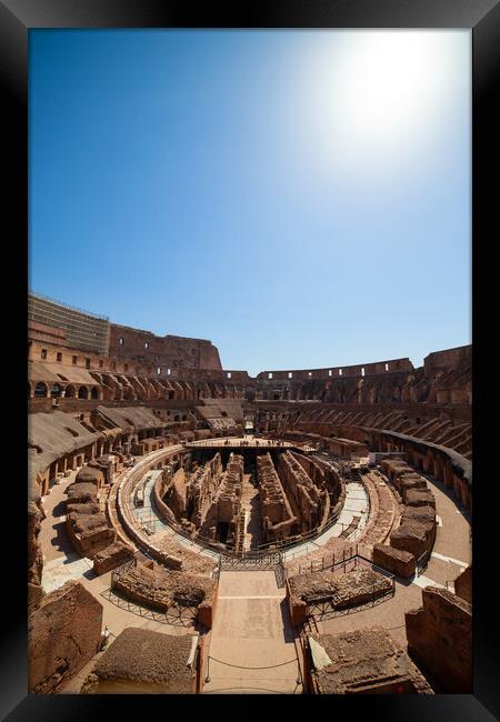Sun Glow Above Colosseum Framed Print by Artur Bogacki