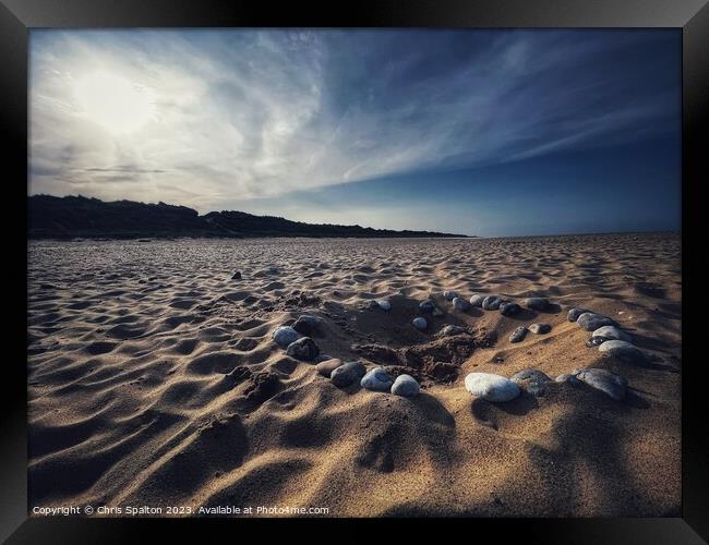 Pebble Circle on Beach Framed Print by Chris Spalton
