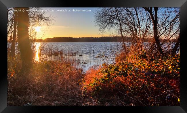 Beautiful and romantic sunset at a lake in yellow and orange col Framed Print by Michael Piepgras