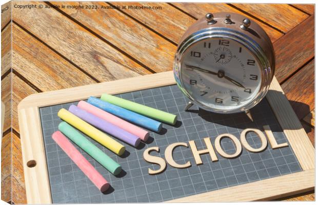 Alarm clock, chalks and chalkboard slate with school written in wooden letters Canvas Print by aurélie le moigne