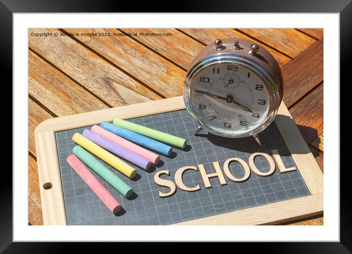 Alarm clock, chalks and chalkboard slate with school written in wooden letters Framed Mounted Print by aurélie le moigne