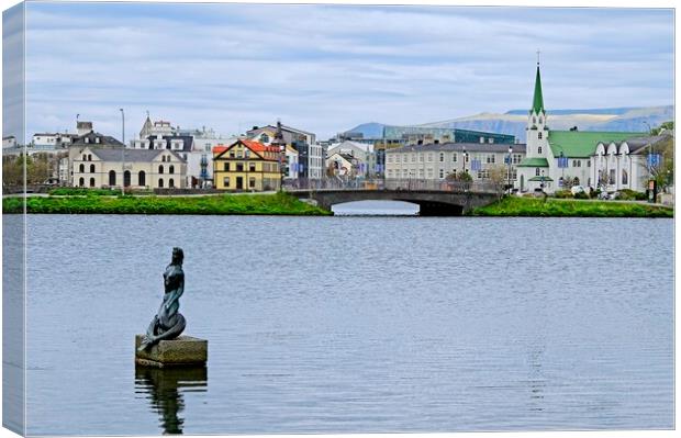 Reykjavik Cityscape Across Tjornin Lake Canvas Print by Martyn Arnold