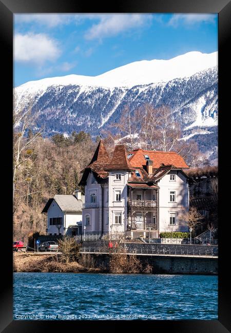 Slovenia's Ancient Bled Castle: A Snow-Clad Specta Framed Print by Holly Burgess