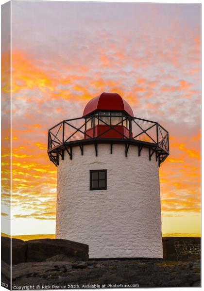 Bury port lighthouse at sunset Canvas Print by Rick Pearce