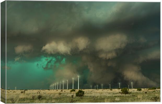 Spectacular Supercell over a windfarm. New Mexico. Canvas Print by John Finney