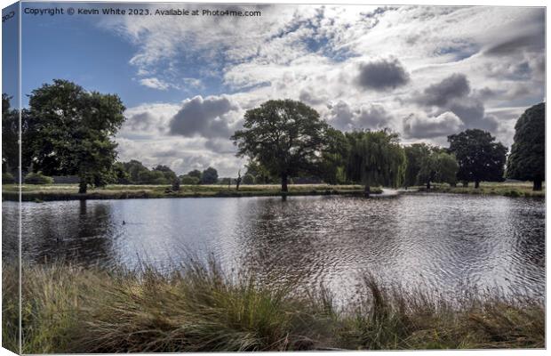 Dramatic rain clouds forming over Bushy Park ponds Canvas Print by Kevin White