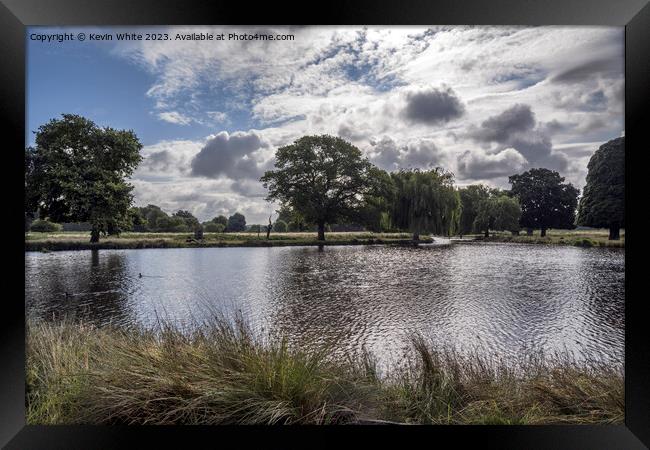 Dramatic rain clouds forming over Bushy Park ponds Framed Print by Kevin White