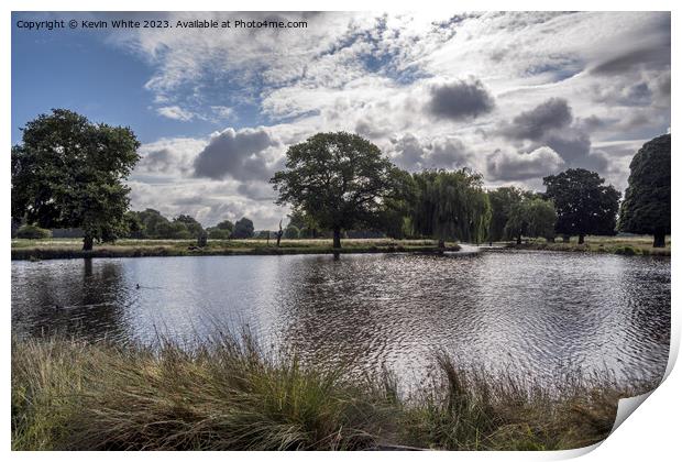 Dramatic rain clouds forming over Bushy Park ponds Print by Kevin White