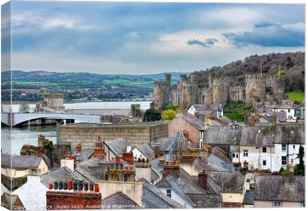 Conwy Castle Over The Rooftops Canvas Print by Rick Lindley