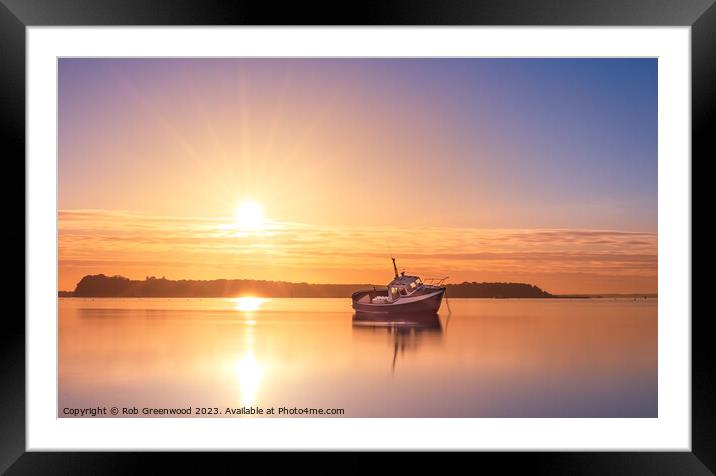 Lone boat at sunset Framed Mounted Print by Rob Greenwood