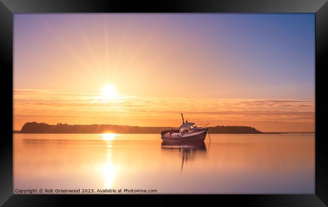 Lone boat at sunset Framed Print by Rob Greenwood