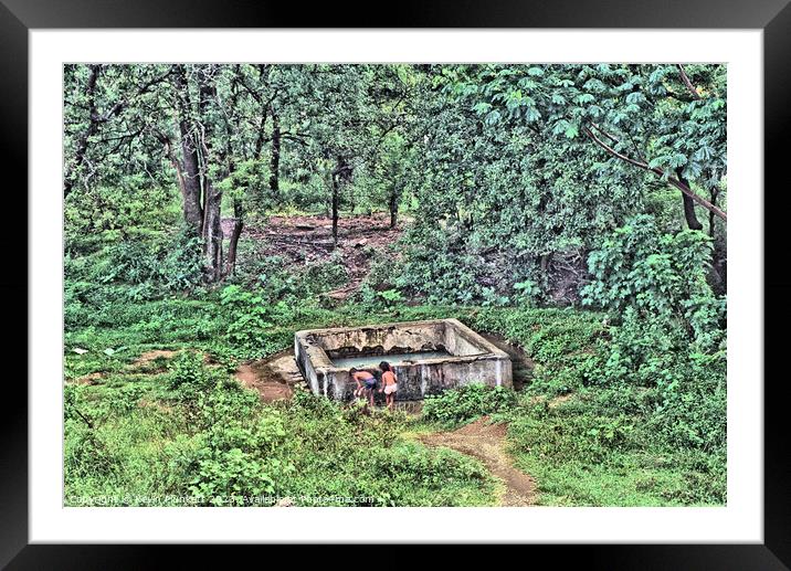 A water tank in a forest. Sri Lanka Framed Mounted Print by Kevin Plunkett