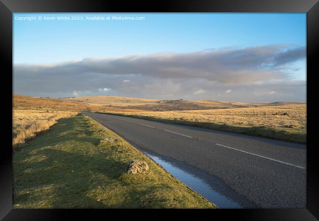 Quiet road on Dartmoor at sunset Framed Print by Kevin White