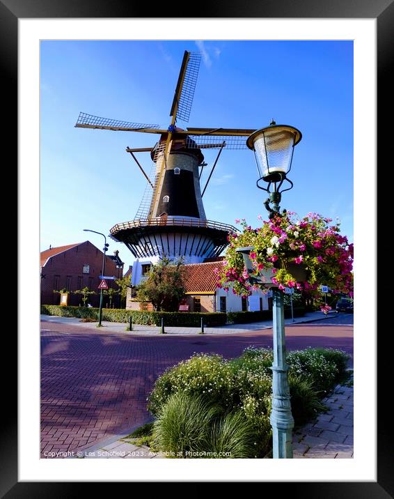 Windmill in wassaner Netherlands  Framed Mounted Print by Les Schofield
