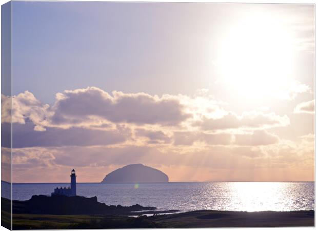 Turnberry lighthouse and Ailsa Craig as sun sets Canvas Print by Allan Durward Photography