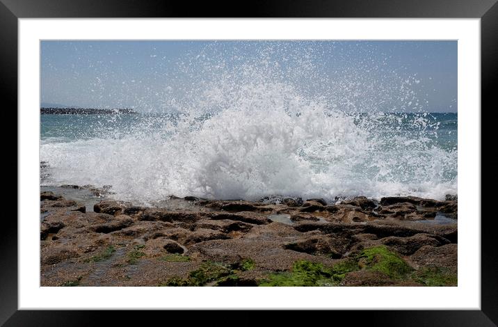 Waves arriving at the coast and splashing on the rocky shore Framed Mounted Print by Lensw0rld 