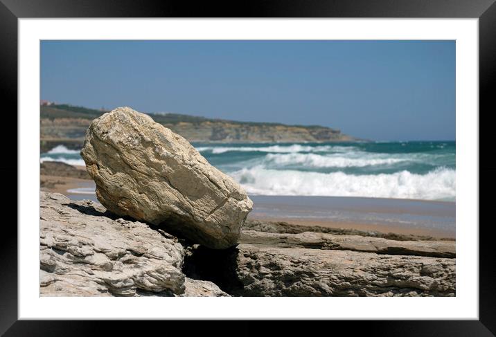 Selective focus on a bolder with waves in the background Framed Mounted Print by Lensw0rld 