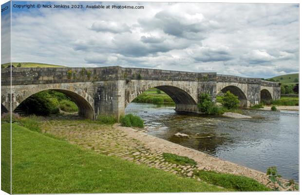 Burnsall Bridge Crossing the River Wharfe Yorkshire Dales Canvas Print by Nick Jenkins