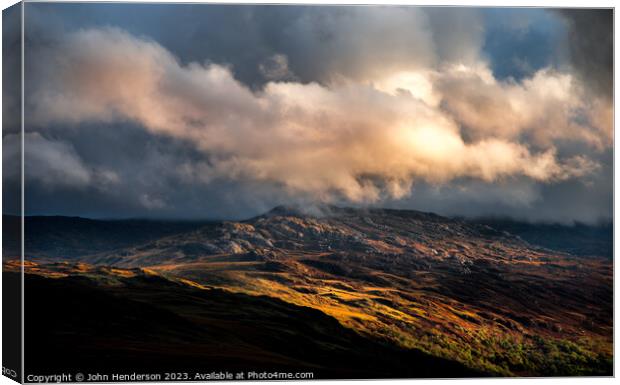 A Welsh landscape of sunshine and showers Canvas Print by John Henderson