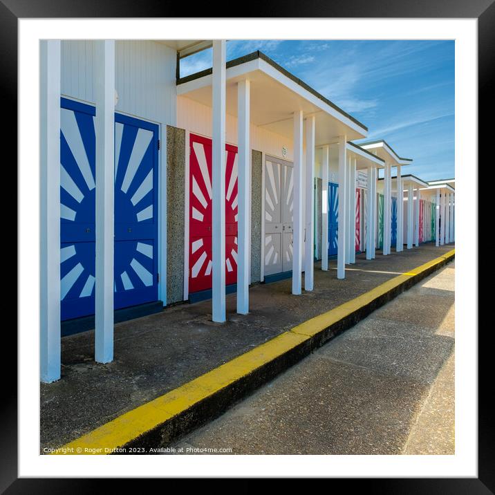 Colourful Beach Hut Promenade Framed Mounted Print by Roger Dutton