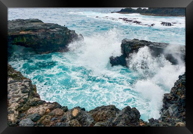 Large waves crash against the volcanic rock in La Palma Framed Print by Madeleine Deaton
