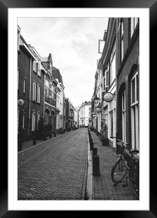 Outdoor street in black and white Framed Mounted Print by Veronika Druzhnieva
