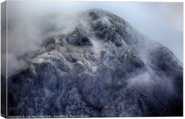 Outdoor mountain covered in snow and fog Canvas Print by Les McLuckie