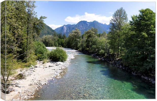 Flowing Skykomish river with cascade mountains  Canvas Print by Thomas Baker