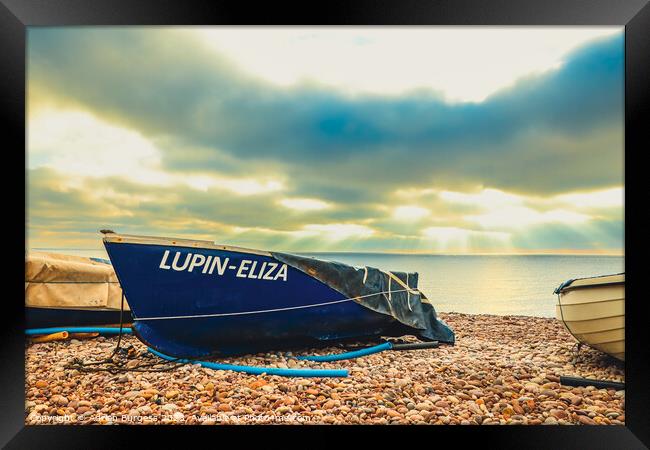 Boat on Budleigh Beach with Sun Rays Framed Print by Adrian Burgess
