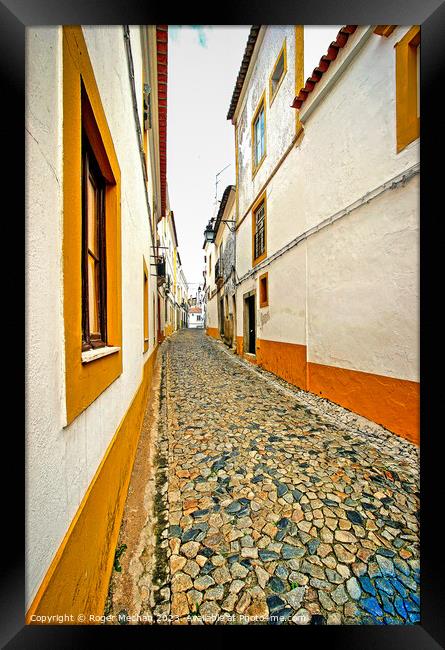 Secret lanes  of Evora Portugal Framed Print by Roger Mechan