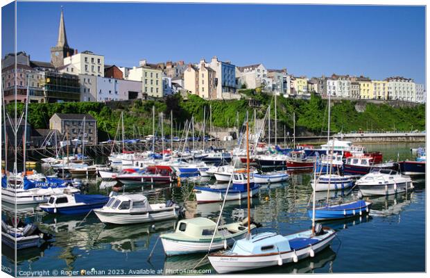 Tenby harbour at high tide. Canvas Print by Roger Mechan