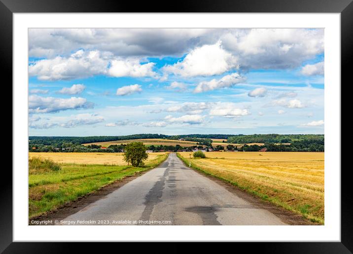 Summer rural landscape with a road among the fields Framed Mounted Print by Sergey Fedoskin