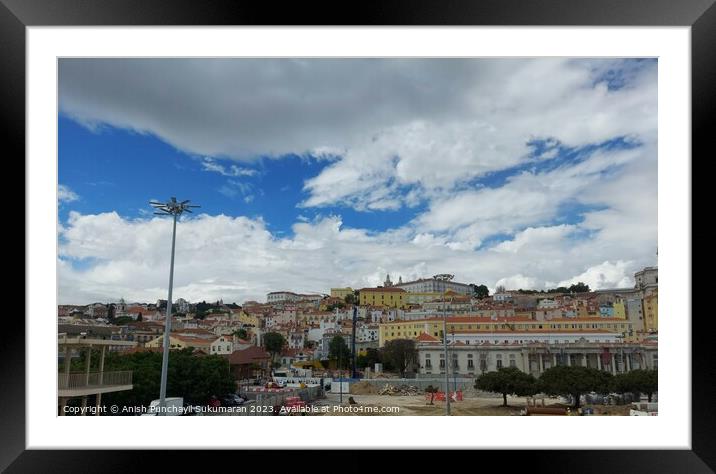 Lisbon cityscape featuring architecture, skyline, and cloudy sky. Framed Mounted Print by Anish Punchayil Sukumaran