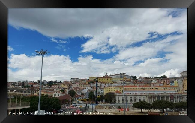 Lisbon cityscape featuring architecture, skyline, and cloudy sky. Framed Print by Anish Punchayil Sukumaran