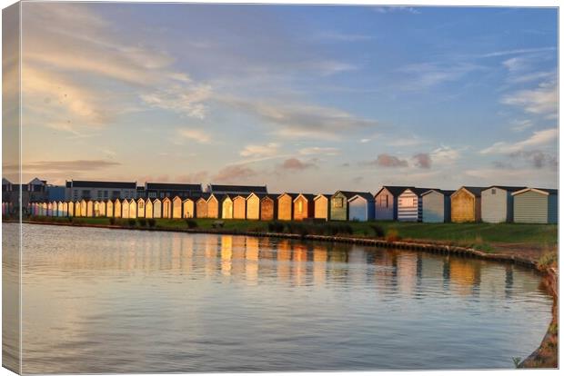 Sunrise reflections across the Brightlingsea Boating lake  Canvas Print by Tony lopez