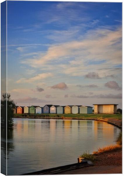 Sunrise over th beach huts around the Boating lake in Brightlingsea  Canvas Print by Tony lopez