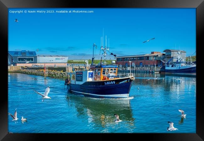 A Fishing Boat arrives in Eyemouth Harbour Framed Print by Navin Mistry